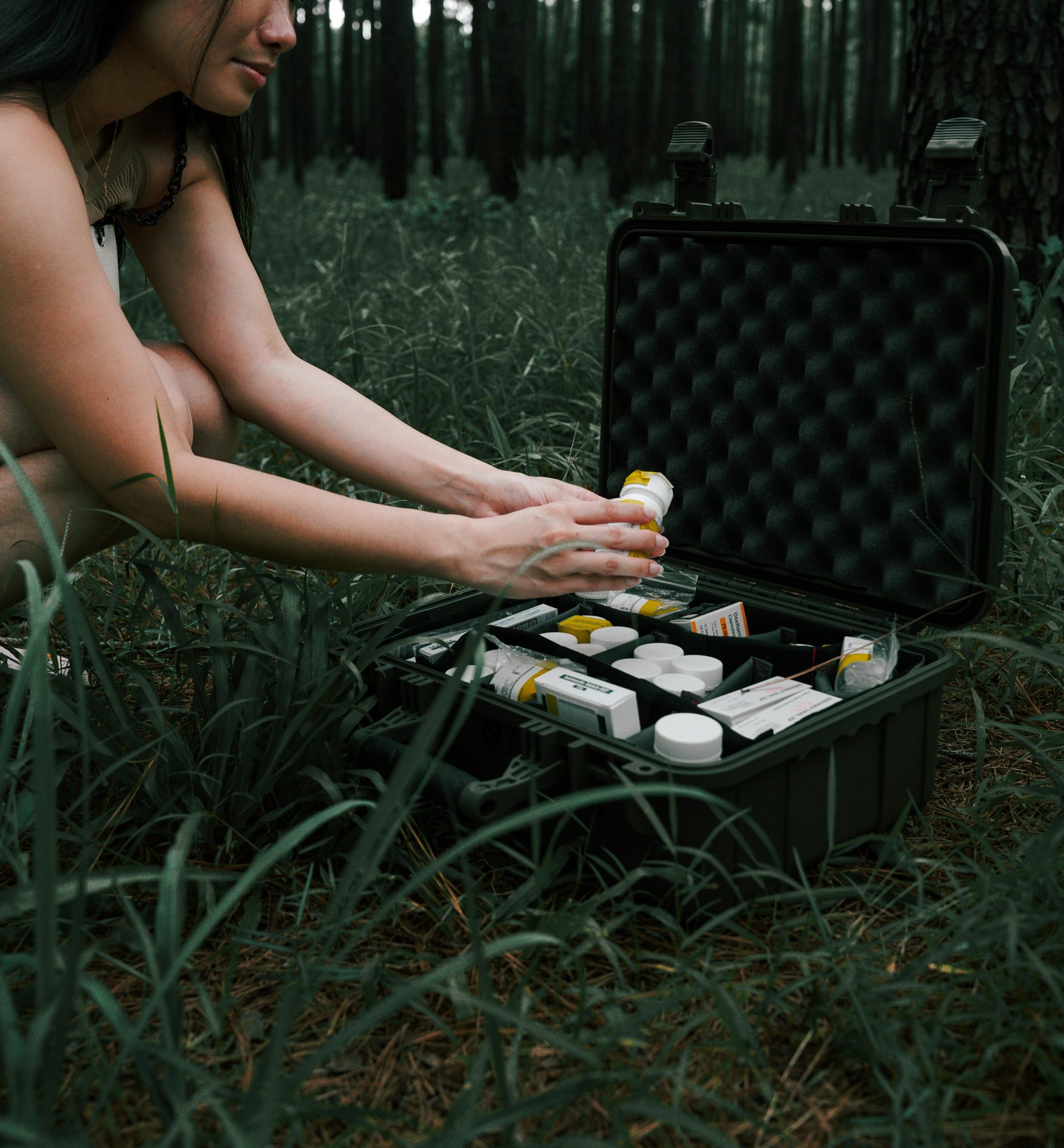Opening the EPFK at a forest campsite to access labeled medications
